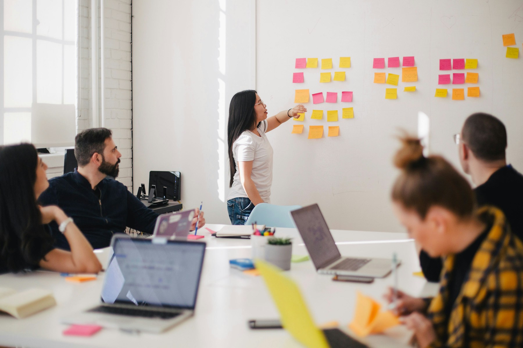 Business team reviewing plans in a workshop